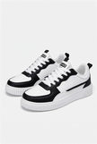 White minimalist men's trainers by FJØRNA, lightweight casual shoes with clean design, suitable for everyday wear.