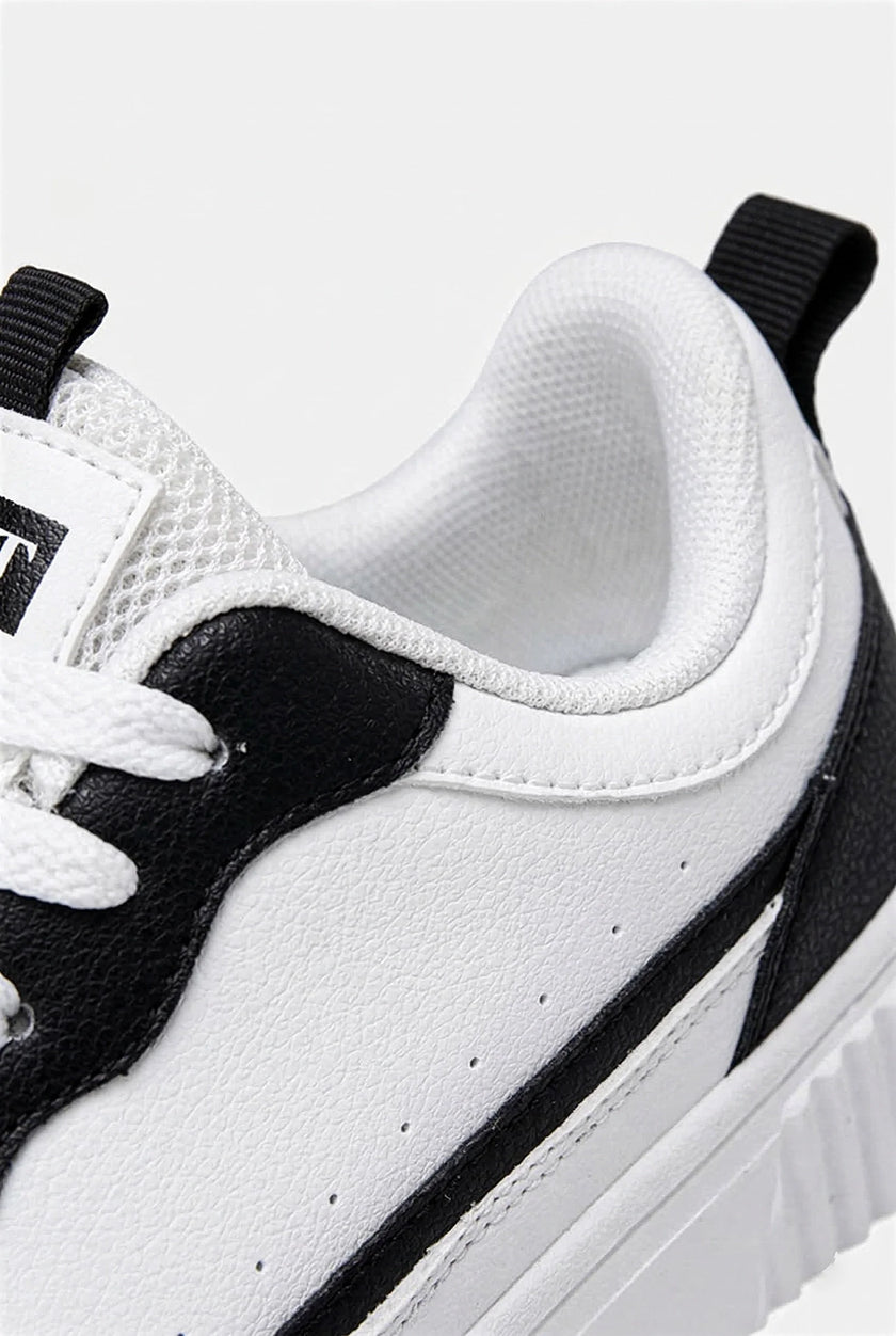 FJØRNA white men's minimalist lightweight casual sneakers, showing a side view of the shoes designed for everyday wear.