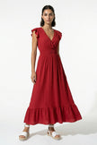 Flowing sleeveless brick red midi dress for women by FJØRNA, shown being worn with a full-body view.