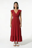 Flowing brick red FJØRNA midi dress for women, sleeveless and elegant, ideal for everyday wear and stylish occasions.