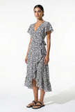 Black and white floral midi dress for women by FJØRNA, featuring an A-line casual summer style, shown on a full-body mannequin.