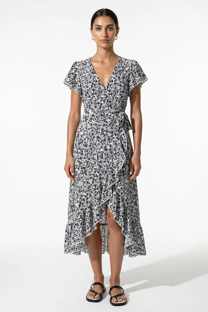 Elegant floral midi dress for women by FJØRNA featuring an A-line silhouette in black and white for casual summer wear.