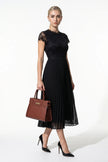 FJØRNA floral lace maxi dress for women, black pleated A-line summer dress with elegant lace details and flowing silhouette.