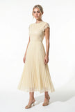 Elegant champagne floral lace maxi dress by FJØRNA featuring pleated A-line design for summer occasions.