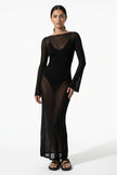 Black FJØRNA maxi dress for women with long sleeves, perfect for beach casual summer wear, flowing and comfortable.
