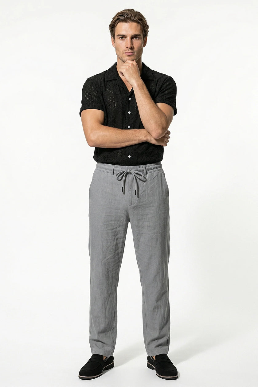 Men's lightweight grey linen trousers by FJØRNA, breathable straight fit summer pants, full-body view.