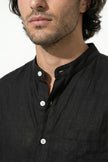 Black men's linen co-ord set by FJØRNA featuring a shirt and trousers, perfect for summer casual wear.
