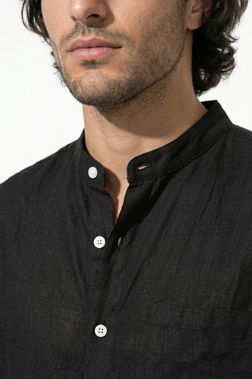 Black men's linen co-ord set by FJØRNA featuring a shirt and trousers, perfect for summer casual wear.