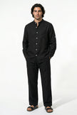 FJØRNA men's linen co-ord set with black shirt and trousers, perfect for summer casual wear, styled for a relaxed look.