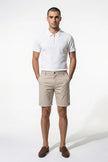 FJØRNA men's cotton chino shorts in champagne color, tailored summer casual pants, full-body view.