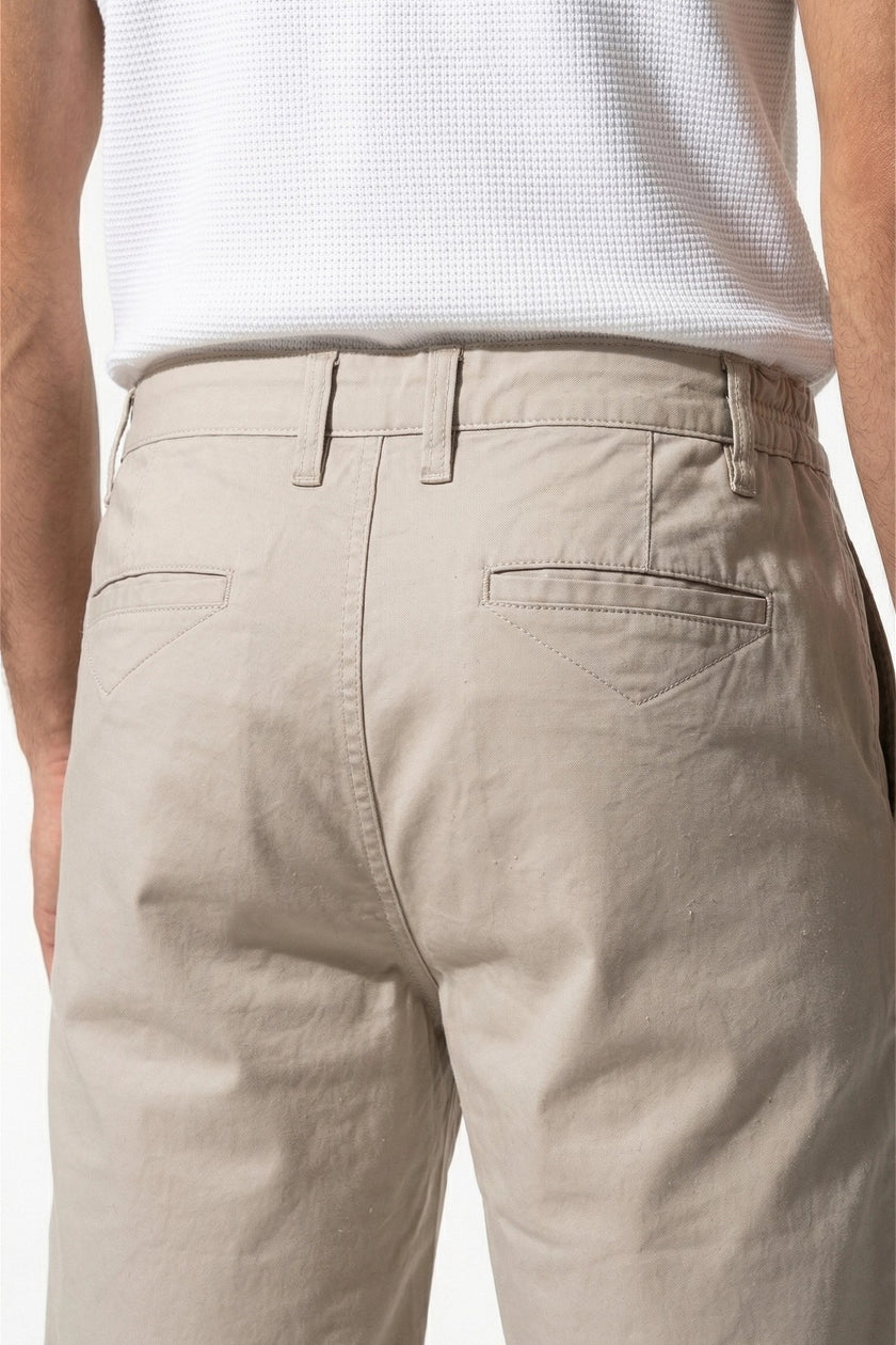 Men's cotton chino shorts by FJØRNA in champagne, tailored summer casual pants with a clean, relaxed fit and smooth fabric.