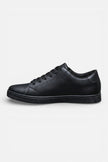 Lightweight breathable men's casual trainers by FJØRNA, showcasing comfortable everyday shoe style in a natural outdoor setting.