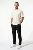 FJØRNA men's slim fit chino trousers in black, stretch ultra-thin fabric, full-body view showcasing tailored men's pants.