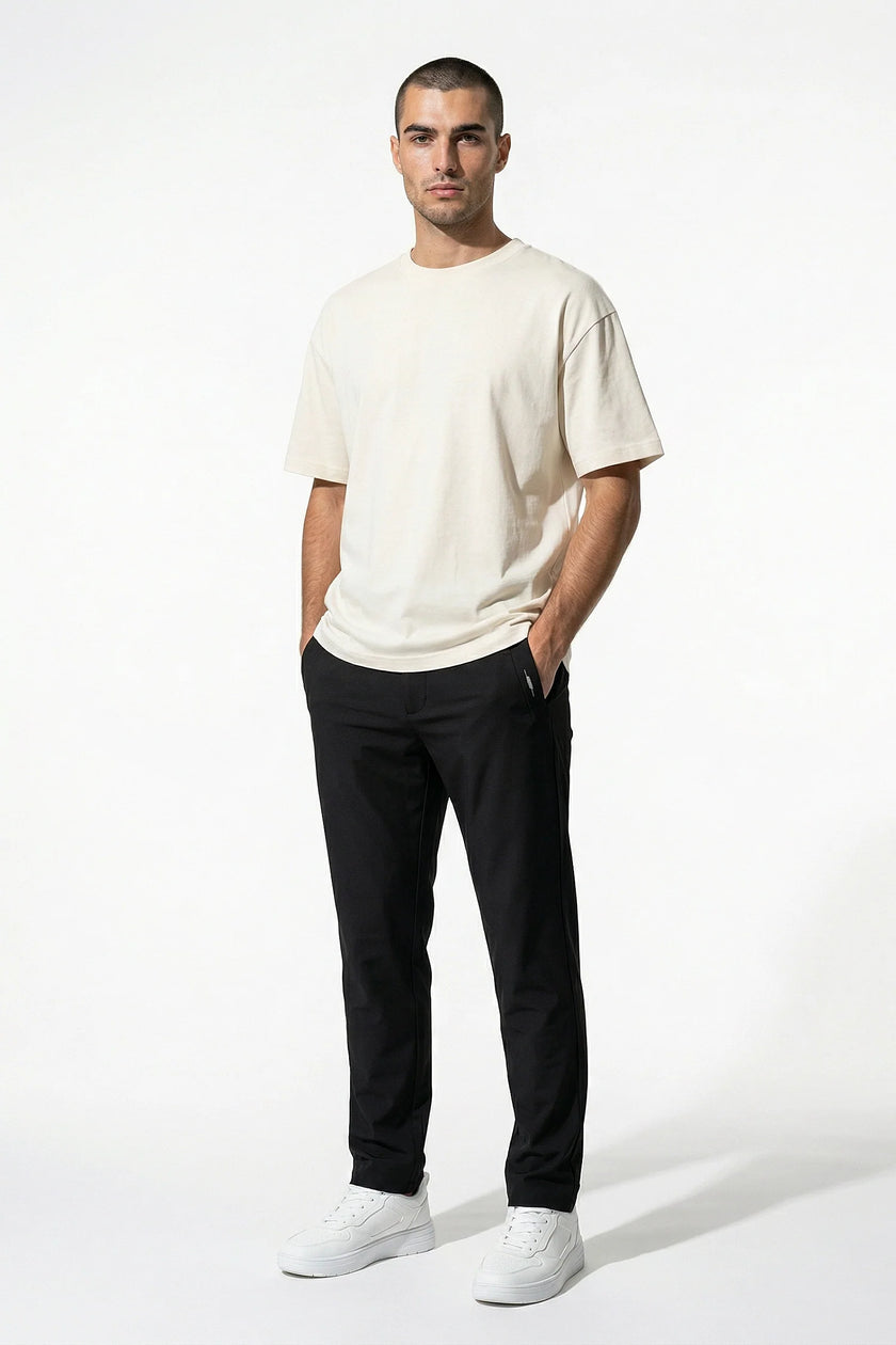 FJØRNA men's slim fit chino trousers in black, stretch ultra-thin fabric, full-body view showcasing tailored men's pants.