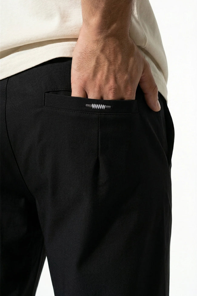 Men's slim fit chino trousers by FJØRNA, black ultra-thin stretch pants with a sleek, modern look and tailored fit.