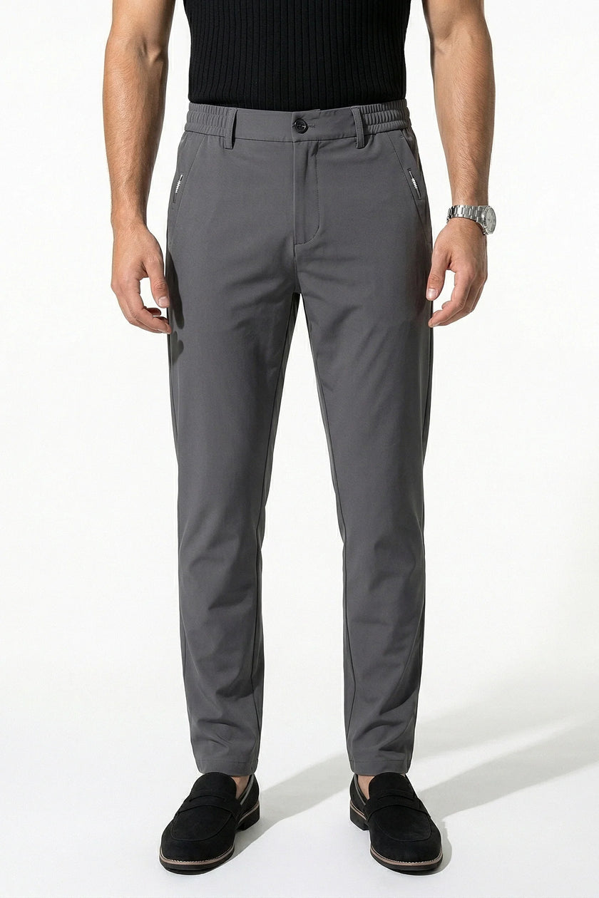 Dark grey FJØRNA men's slim fit chino trousers with stretch, ultra-thin fabric, styled as casual men's pants.