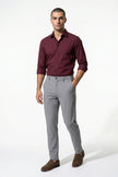 Men's slim fit chino trousers by FJØRNA, ultra-thin stretch fabric in light grey, full-body view showing tailored design.