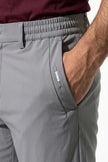 Light grey men's slim fit chino trousers by FJØRNA, ultra-thin stretch fabric, casual pants with a sleek, modern style.