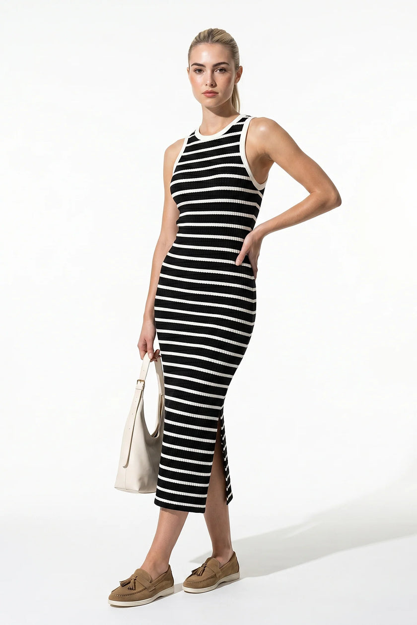 Black ribbed midi dress by FJØRNA, sleeveless, slim fit, casual women’s dress shown full body view.