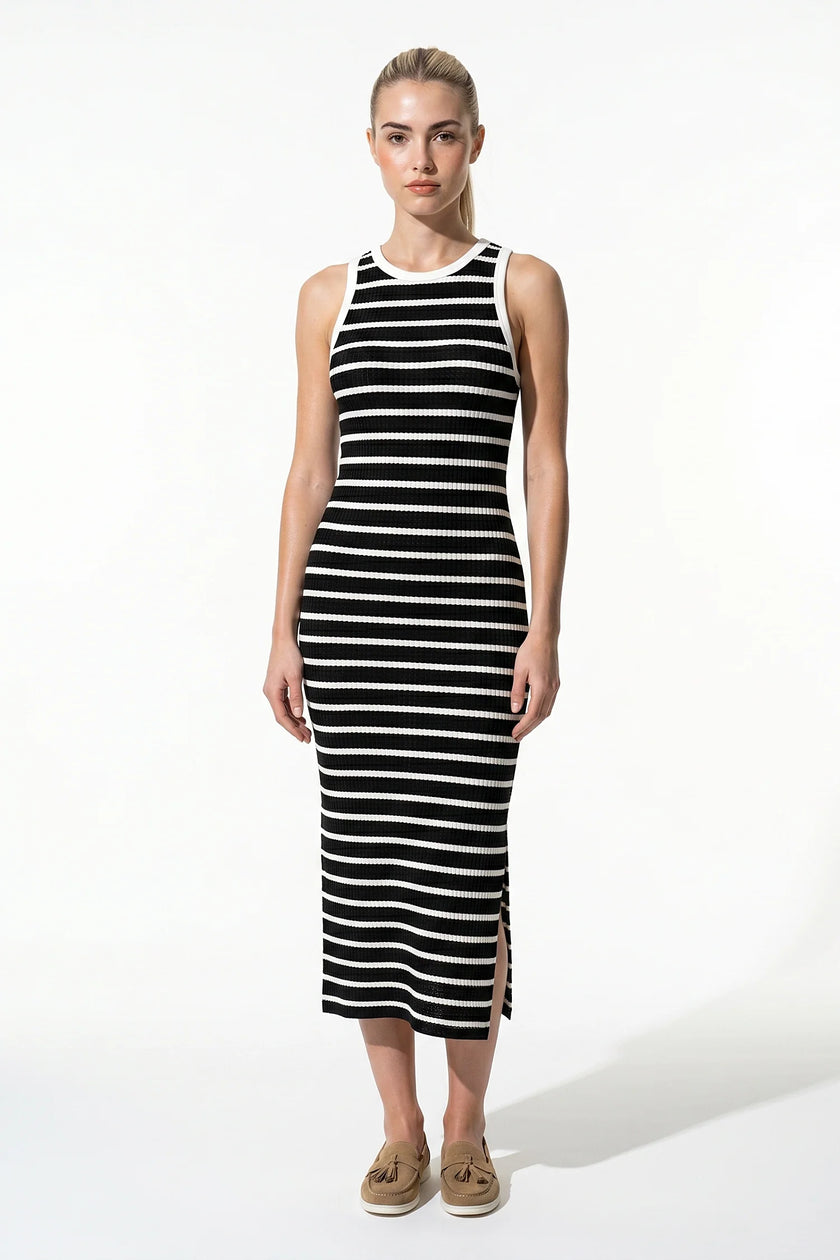 Black ribbed midi dress by FJØRNA featuring a slim fit, sleeveless design, perfect for casual women’s fashion.