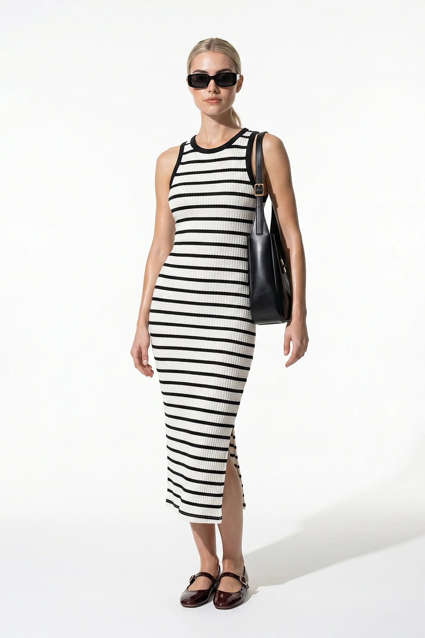 White FJØRNA ribbed midi dress for women, slim fit and sleeveless, casual style, shown on a full-body mannequin.