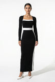 Black and white monochrome bodycon maxi dress for women by FJØRNA, shown from a 3/4 front view highlighting fitted silhouette.