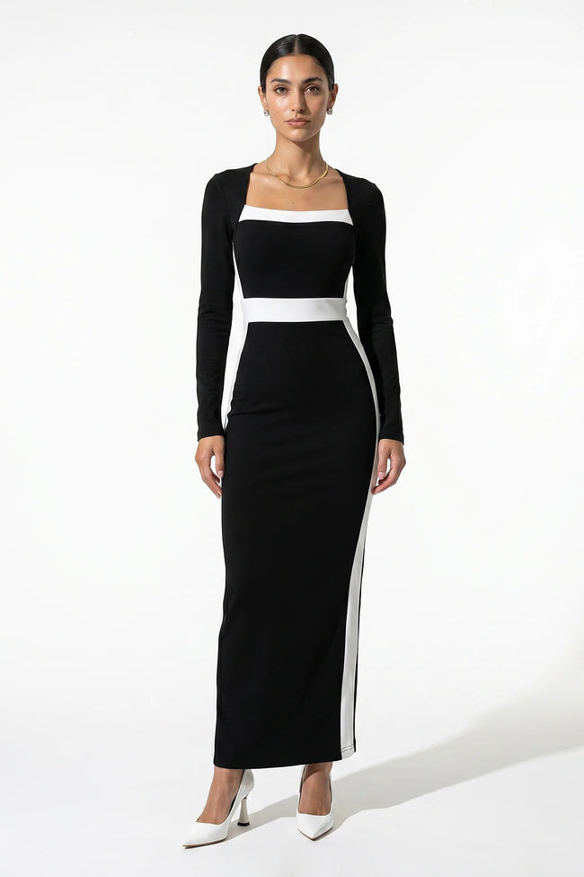 Black and white monochrome bodycon maxi dress for women by FJØRNA, shown from a 3/4 front view highlighting fitted silhouette.
