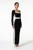 Black and white monochrome bodycon maxi dress for women by FJØRNA, shown from a 3/4 view highlighting fitted silhouette and stylish design.