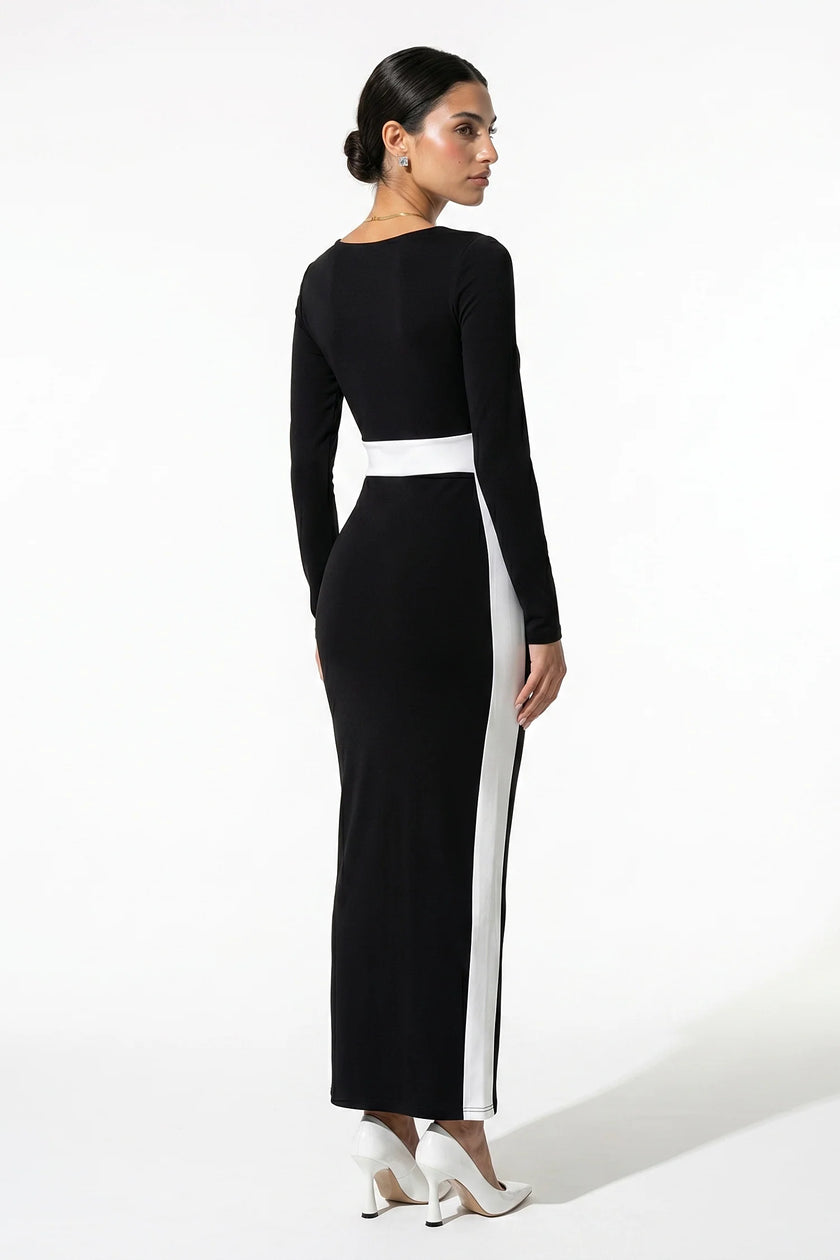 Back view of FJØRNA women's black and white monochrome bodycon maxi dress, fitted silhouette and elegant design.