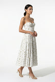 Green floral sleeveless midi dress for women by FJØRNA, lightweight summer dress with a flowing, casual style.
