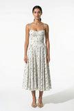 FJØRNA floral midi dress for women, sleeveless lightweight summer dress with green floral pattern on smooth fabric.