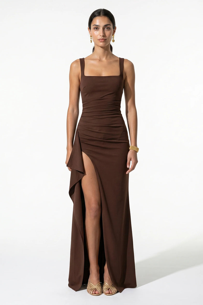 Brown high-slit maxi dress for women with sling design and sleeveless style by FJØRNA, shown on a model.