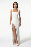 White FJØRNA high-slit maxi dress for women featuring a sleeveless, sling design and elegant flowing fabric.