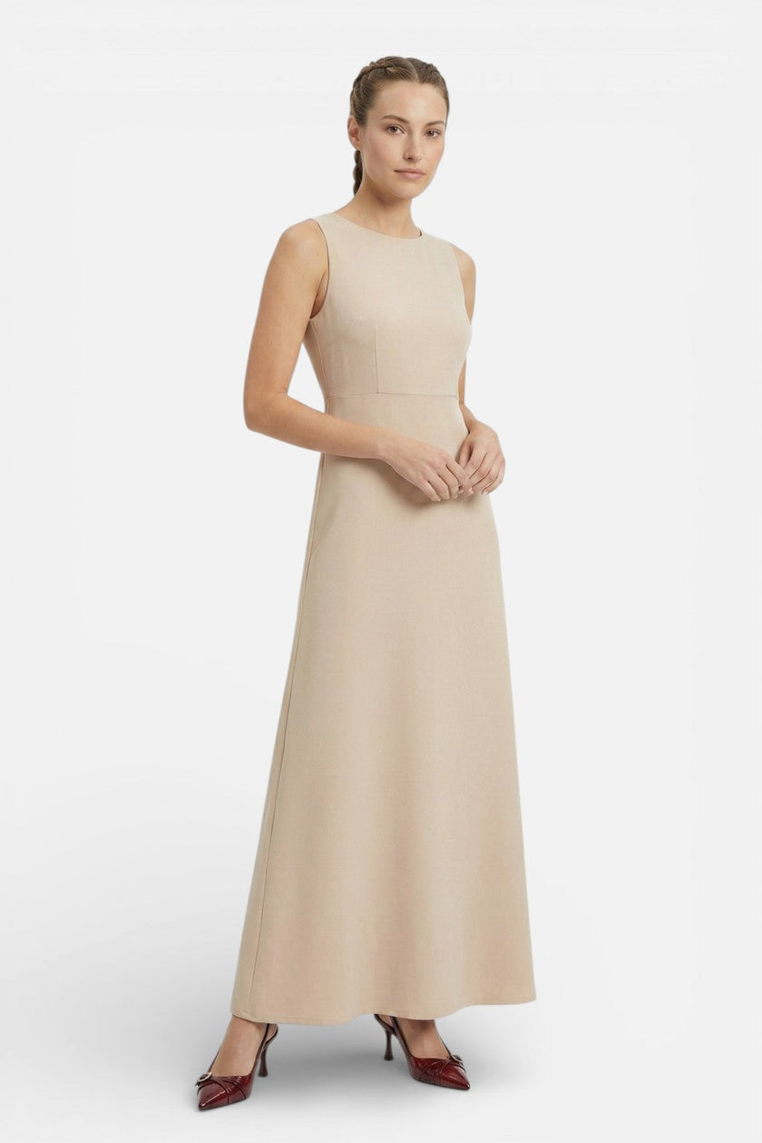 Flowing sleeveless maxi dress for women by FJØRNA, casual summer style with a relaxed, coastal-inspired design.
