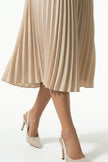 FJØRNA women's apricot pleated A-line midi dress with round neckline, casual style, shown on a mannequin.