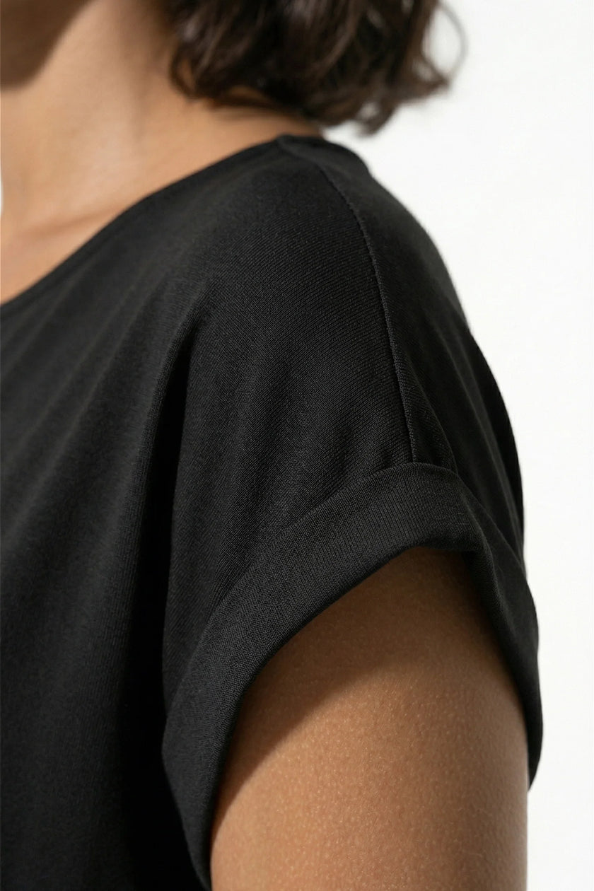 Black women's pleated midi dress by FJØRNA featuring an A-line silhouette and round neck, perfect for casual wear.