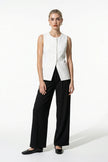 FJØRNA women's sleeveless white fitted waistcoat with button front, perfect for summer fashion, full-body view.