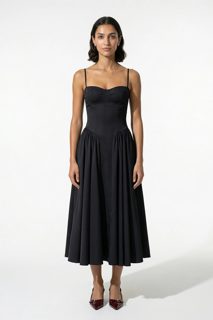 Black sleeveless backless midi dress for women by FJØRNA, featuring pleated design and halter neckline.