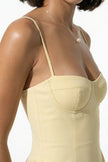 FJØRNA women's sleeveless backless midi dress in butter yellow with pleated design and halter neckline, perfect for warm weather.