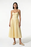 FJØRNA women's backless sleeveless midi dress with pleated design in butter yellow, halter neckline, elegant and flowy silhouette.