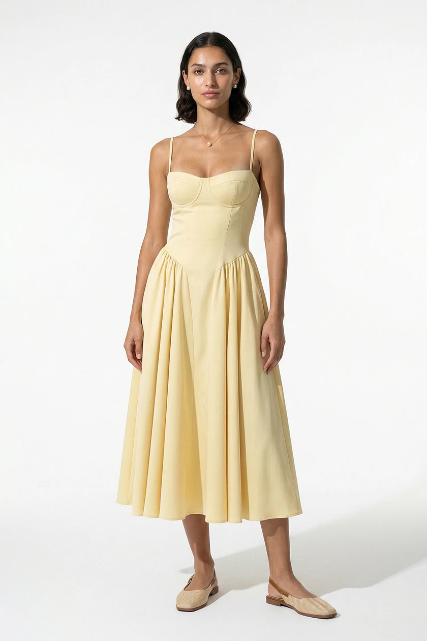 FJØRNA women's backless sleeveless midi dress with pleated design in butter yellow, halter neckline, elegant and flowy silhouette.