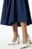 Deep blue sleeveless backless midi dress by FJØRNA featuring pleats and a halter neckline, perfect for elegant occasions.