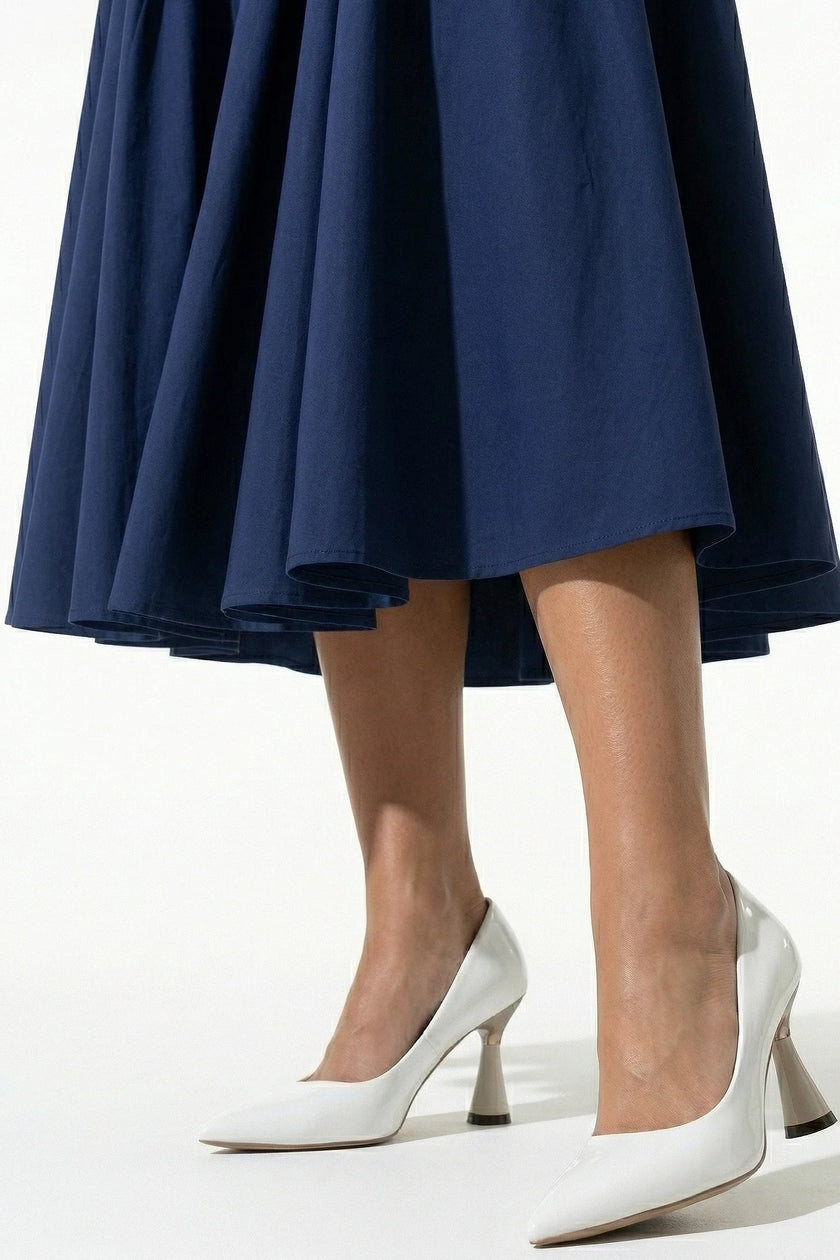 Deep blue sleeveless backless midi dress by FJØRNA featuring pleats and a halter neckline, perfect for elegant occasions.