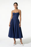 Deep blue FJØRNA sleeveless backless midi dress with pleats and halter neckline, perfect for elegant occasions.