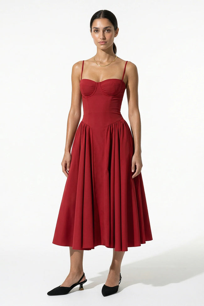 Red FJØRNA sleeveless pleated halter backless midi dress, elegant occasion dress with a flowing silhouette and sleeveless design.