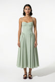 FJØRNA women's backless midi dress in sage green with sleeveless, halter neckline and pleated design.