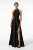 Black FJØRNA sleeveless maxi dress with high neck and side slit, featuring an A-line silhouette and elegant sleeveless design.