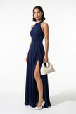 Navy blue FJØRNA sleeveless maxi dress for women with high neckline, A-line silhouette, and side slit, full-body view.