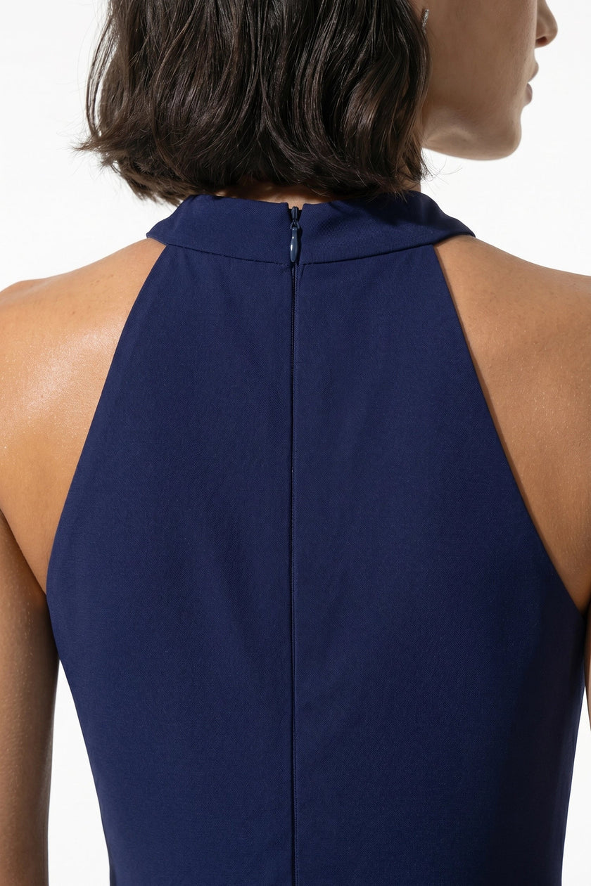Navy blue FJØRNA sleeveless maxi dress for women with high neck, A-line silhouette, and side slit, displayed in macro shot.