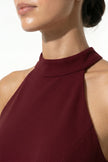 Red FJØRNA sleeveless maxi dress with high neckline, A-line silhouette, and side slit, perfect for elegant summer occasions.